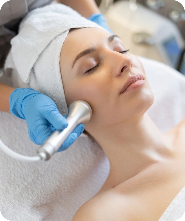young-woman-lying-cosmetologist-s-table-rejuvenation-procedure-cosmetologist-take-care-about-neck-face-skin-youthfull-wellness-hardware-face-cleaning-@2x